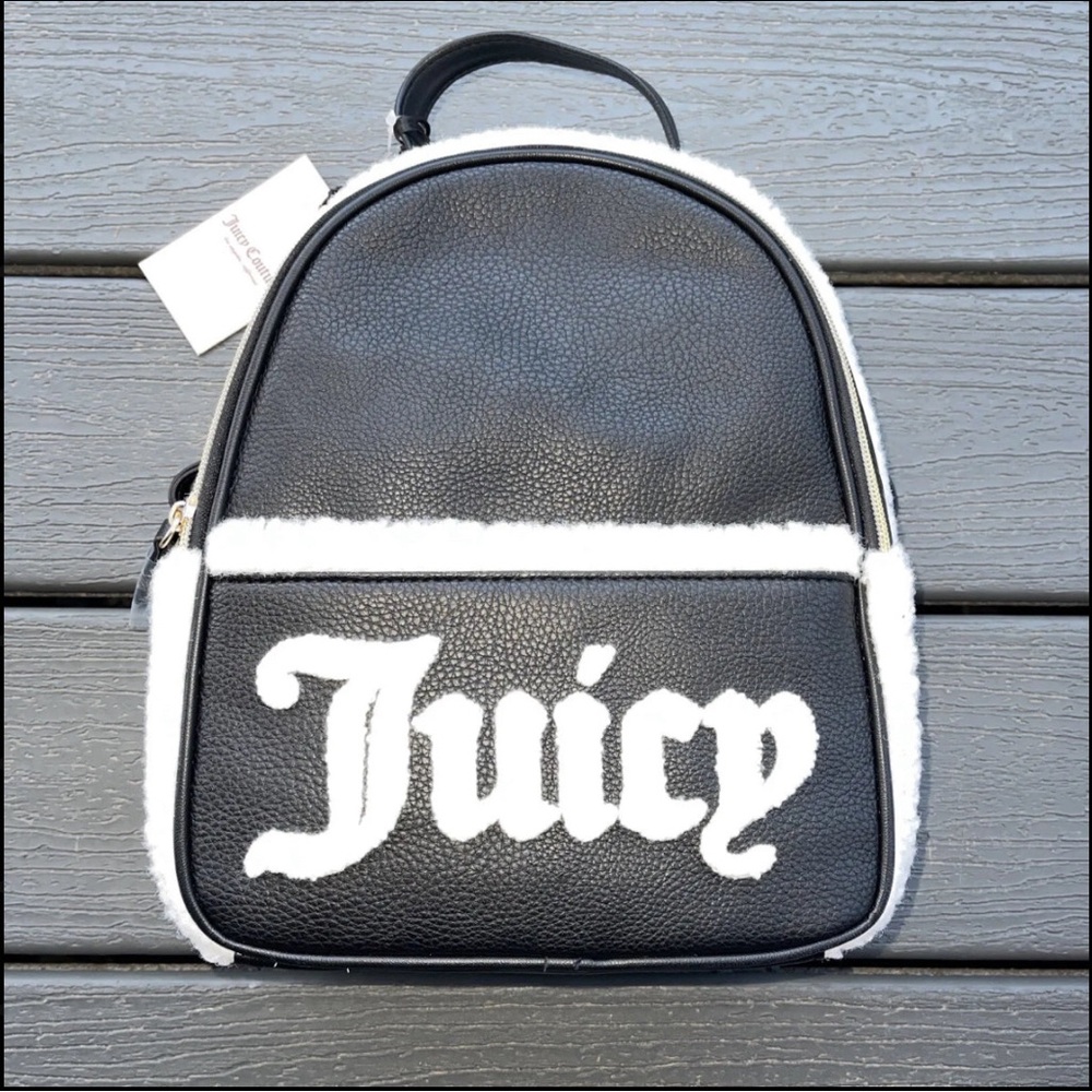 This stunning black and white Juicy Couture backpack purse